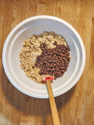 Adding chicken to pan